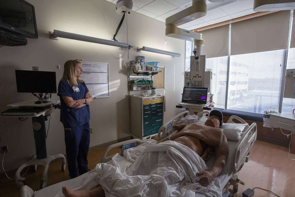 Clinical educator Donna Osborne shows the simulation lab at Kadlec Regional Medical Center where a human-like piece of equipment is used to help employees prepare and practice for real patients.