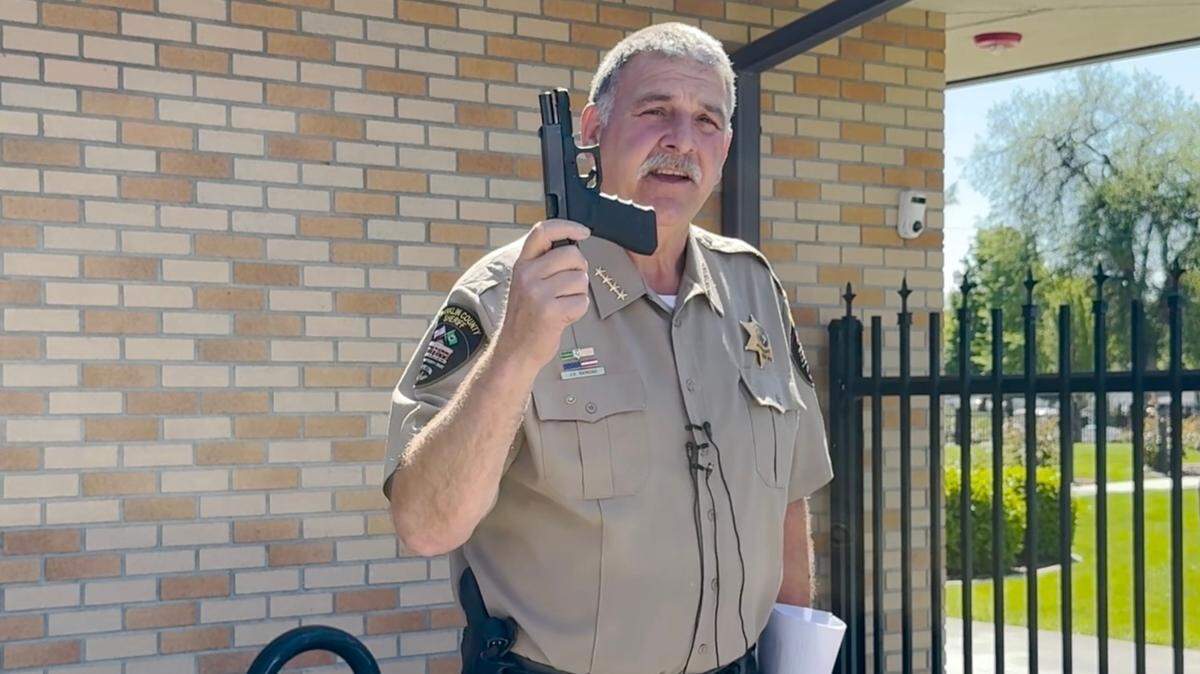 Franklin County Sheriff Jim Raymond has questioned whether the new county corrections department has the legal authority to allow corrections officers to carry weapons, including guns. 