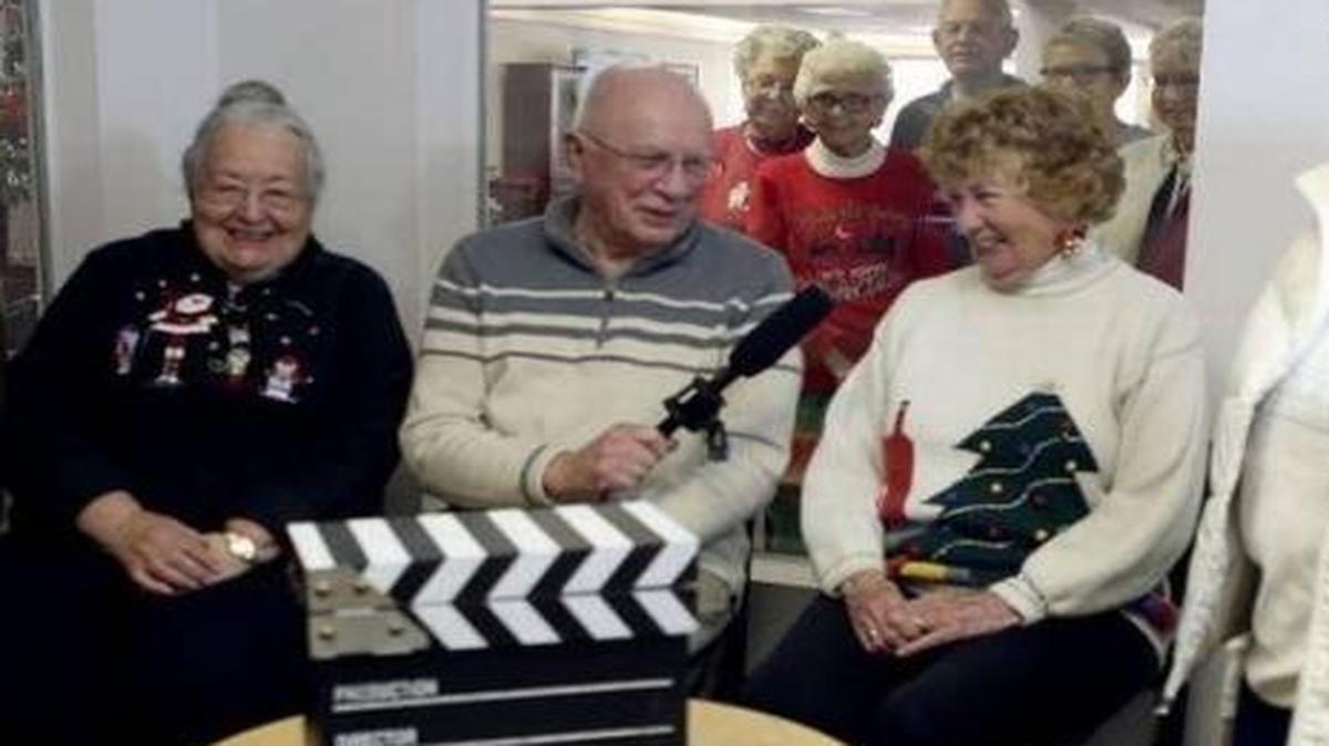 Residents at Brookdale Canyon Lakes in Kennewick laugh as they attempt to read the teleprompter during a rehearsal for their weekly news show, This Week at Canyon Lakes, in this file photo. About a dozen residents, including some pictured, recently created a short film that’s a finalist a film festival.