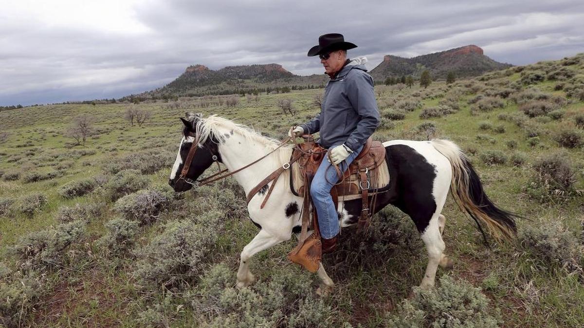 Interior Secretary Ryan Zinke rides a horse in May in the new Bears Ears National Monument near Blanding, Utah. Zinke said Thursday that he won’t seek to rescind any national monuments, but would press to change some boundaries. He left open the possibility that the Trump administration could allow new access to oil and gas drilling, logging and other industries.