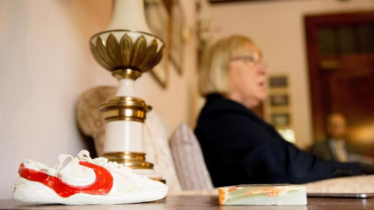 A sneaker made out of clay sits on a table next to Sen. Patty Murray, D-Wash. as she speaks in her office on Capitol Hill in Washington. Murray has often made reference to a story of a state representative who once told her that she could not make a difference because she was just a “mom in tennis shoes.”