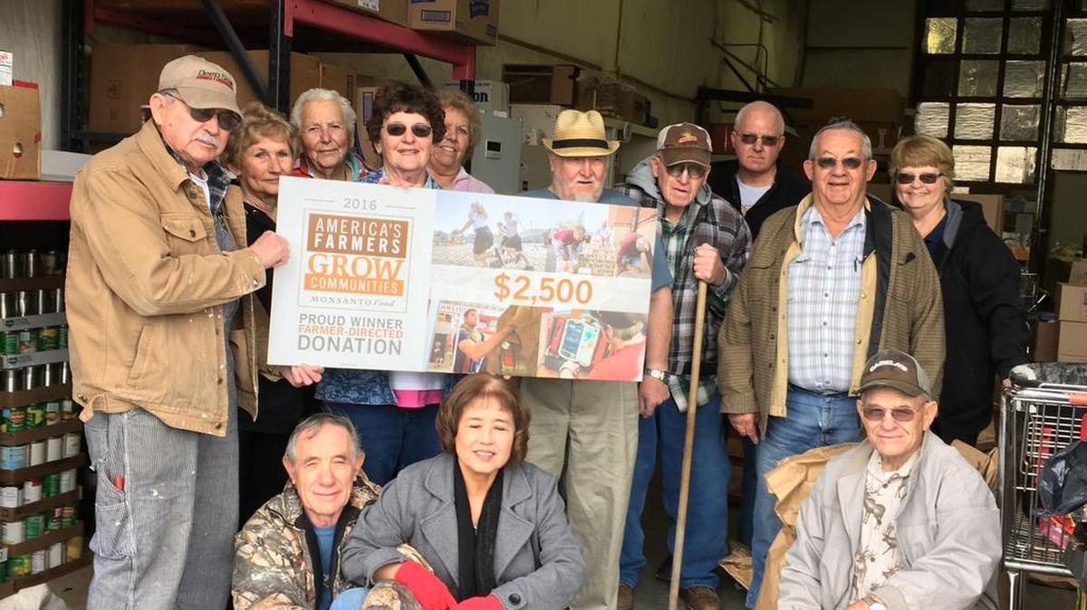 Royal City Food Bank volunteers pose with their $2,500 donation. Pictured, back row, from left, are Michael Moore, Maggie Nielsen, Pearl Fletcher, director Dorothy Lee, Babe Morgan, Al Weisbeck, Pat Lee Sr., Jerry Eilers, Tom Freeman and Jody Weber. Front row, from left: Deuane and Shigeko Spencer and Frank Sparks.