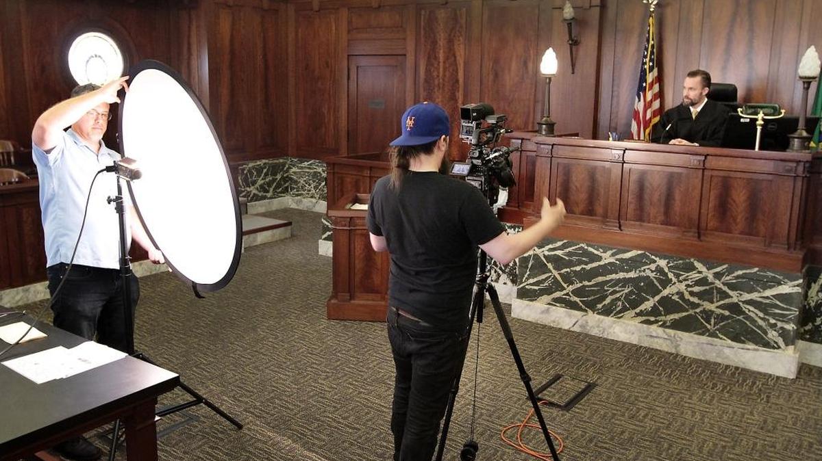 TVW employees David Johnson, left, and Brett Hansen record Superior Court Judge Alex Ekstrom on the bench of the historic courtroom in the Franklin County Courthouse on Friday as part of public service announcement for jurors. The PSA will be available for viewing online, on Comcast Digital and Telemundo in about a month, said Johnson. The commercial is a project of the Public Trust & Confidence committee. Watch a video at: www.tricityherald.com/video.