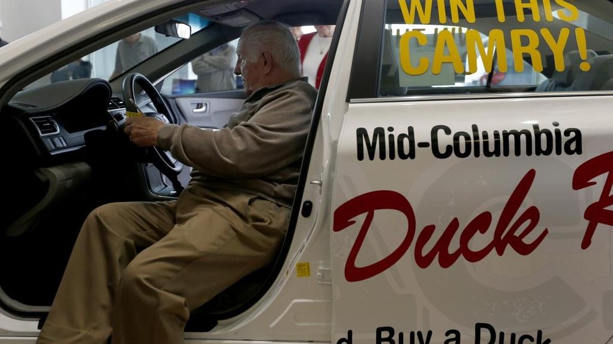 James Malott, grand prize winner, climbs into the driver’s seat of a new 2015 Toyota Camry LE on Friday at Toyota of Tri-Cities. He won the car in the Rotary Mid-Columbia Duck Race. A total of 37,660 tickets were sold for this year’s race to raise money for nonprofits.
