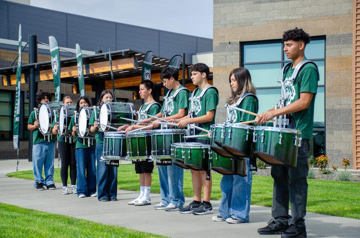 The Sageview High School Lobos marching band plays a number at the ribbon cutting ceremony in August 2025, christening their brand new high school.