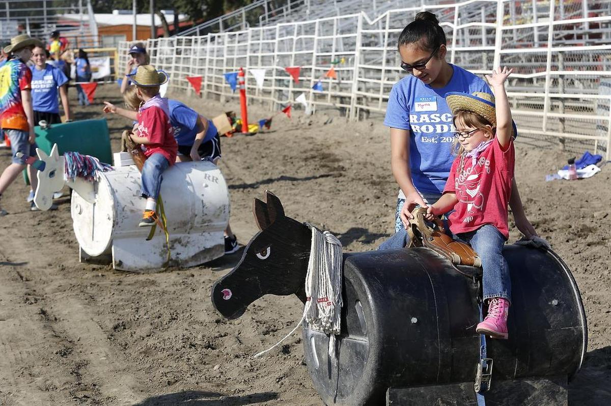 Three-year-old Sophia Harris of West Richland practices her one-hand riding technique in August 2017 during a Rascal Rodeo event in the rodeo arena at the Benton Franklin Fair & Rodeo in Kennewick.