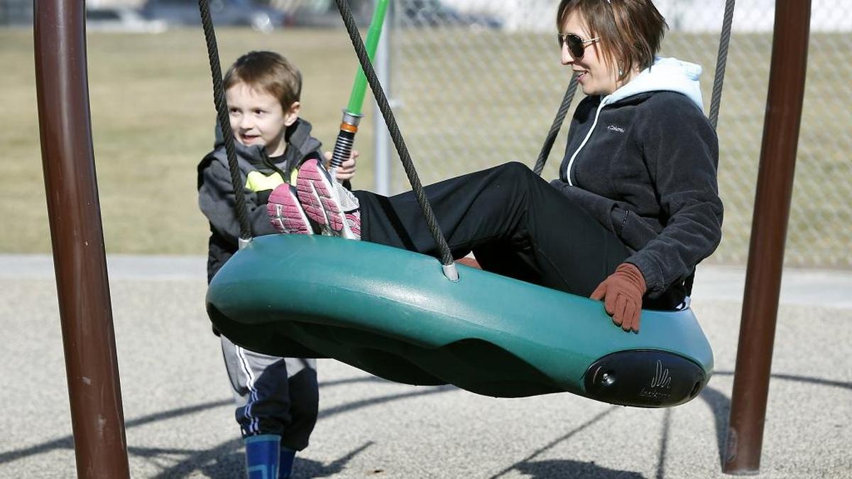 Kristen Myrick of Richland and her 4-year-old son, Corbin, take turns on the playground equipment at Claybell Park in Richland. Myrick said the powerful pull of Thursday’s sunny skies beckoned them outside to “enjoy our day.” The National Weather Service forecast is for continued sunny conditions for the next couple of days.