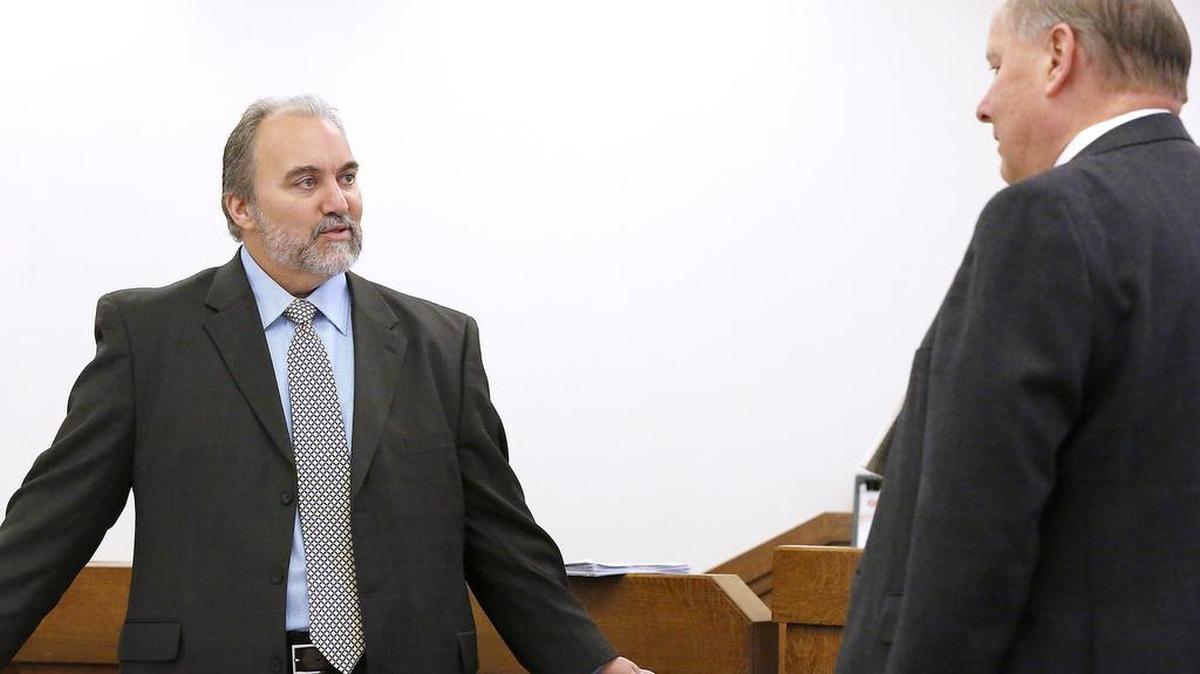 Public defense attorney Craig Stilwill, left, has a conversation with Franklin County Deputy Prosecutor Frank Jenny during a recess in Franklin County Superior Court.