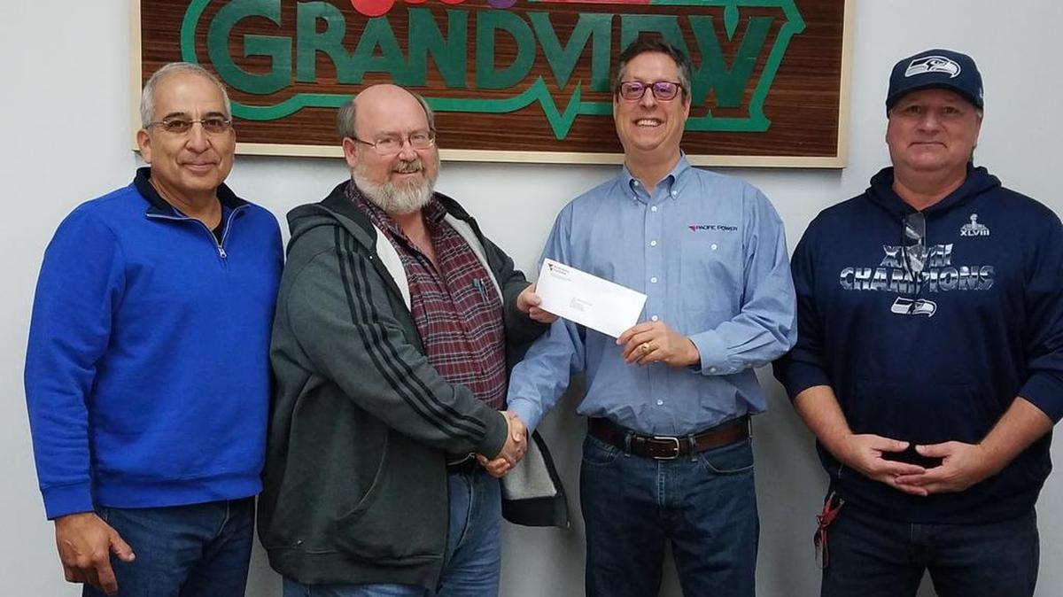 The city of Grandview was awarded a $4,000 grant from the Pacific Power Foundation. From left to right: Cus Arteaga, city administrator; Mayor Norm Childress; Toby Freeman, regional business manager with Pacific Power; and Mike Carpenter, Parks & Recreation director.