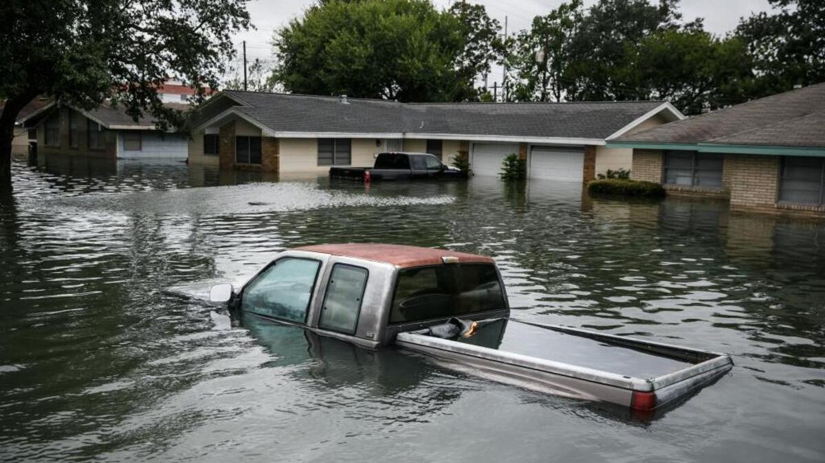 Floodwater engulfs homes in the wake of Tropical Storm Harvey in Port Arthur, Texas, on Wednesday.