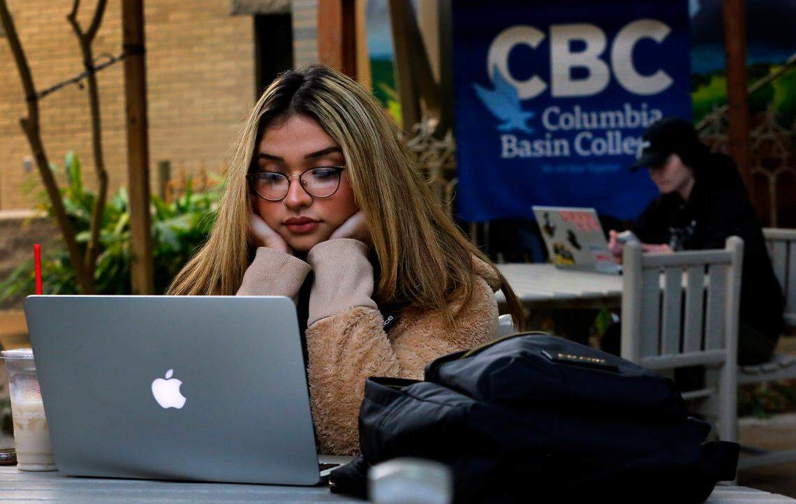 Student Melani Padilla Torres of Kennewick attends an online class while sitting in the Thornton courtyard at the Columbia Basin College Pasco campus on the first day of fall classes of the new academic year. College officials say their first day numbers show a 6.4% increase over last year, with a total of 5960 students enrolled.