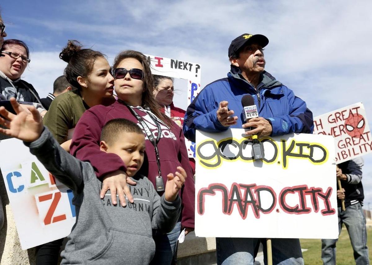Jessica Moreno, left, speaks at the Benton County Justice Center in Kennewick, where the family of Marc Moreno, 18, demanded answers regarding his death in custody at the county jail. Moreno’s estate will file a claim for damages on Nov. 28.