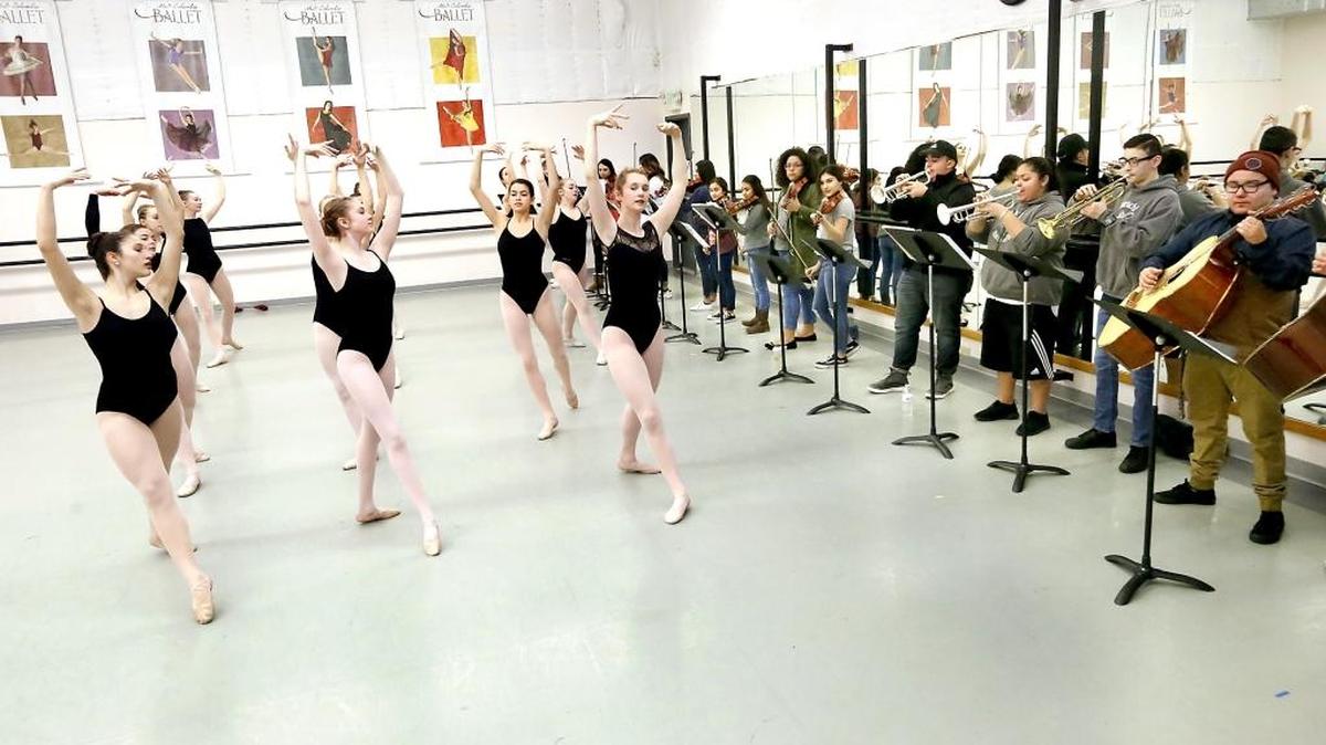 Members of the Mid-Columbia Ballet and Mariachi Halcón del Rio, an ensemble from Chiawana High School, rehearse a new collaborative ballet Monday at the Tri-Cities Academy of Ballet in Richland. Watch a video at: tricityherald.com/video