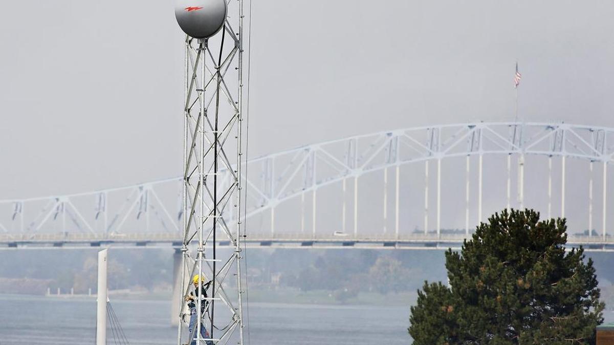 
Margaret Demers works Thursday high above the ground performing maintenance on a radio antenna tower at the U.S. Coast Guard building on Clover Island in Kennewick. Demers, an employee of an Alaskan-based company called Alutiiq, said she typically has a pretty good view while on the job.
