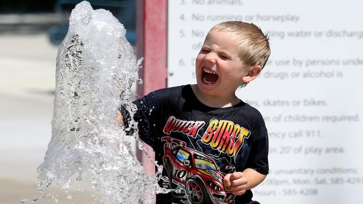 Phinigan Truesdale, 5 of Pasco, yells as he punches a spray of water Wednesday at Columbia Park in Kenenwick. High temperatures through June 3 should be in the mid-80s to 90 degrees, June 4 will see a high in the upper 90s and Sunday could reach triple digits. The city of Kennewick’s aquatic playgrounds are open every day from 11 a.m. to 7 p.m., Richland’s are open from 10 a.m. to 8 p.m. and Pasco’s are open 11 a.m. to 7 p.m.
