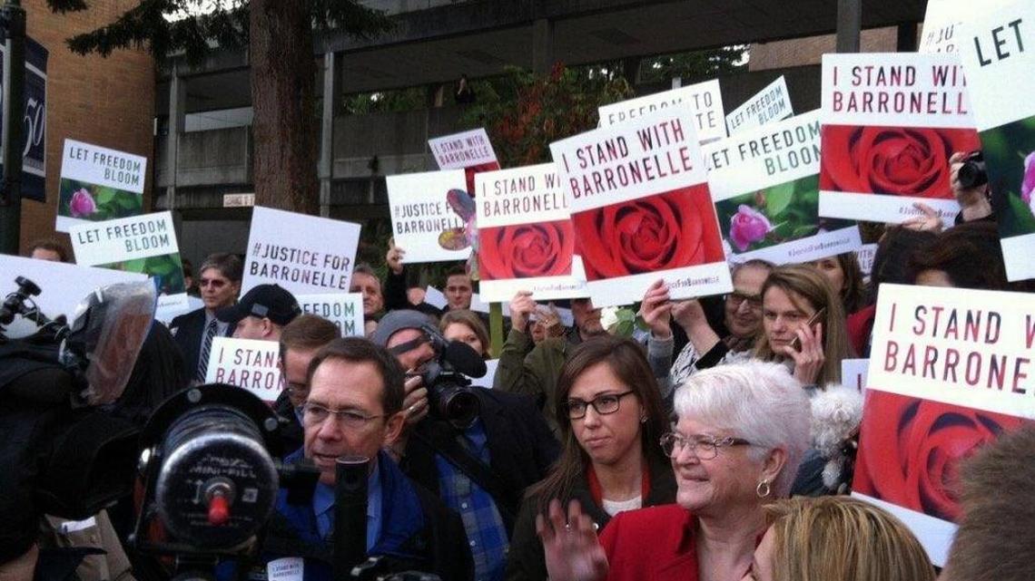 Richland florist Barronelle Stutzman, in red, talked in 2015 with supporters after her case was argued before the state Supreme Court in Bellevue. She refused to provide flowers for a gay couple’s wedding, citing her religious beliefs. Her case is on appeal to the U.S. Supreme Court.