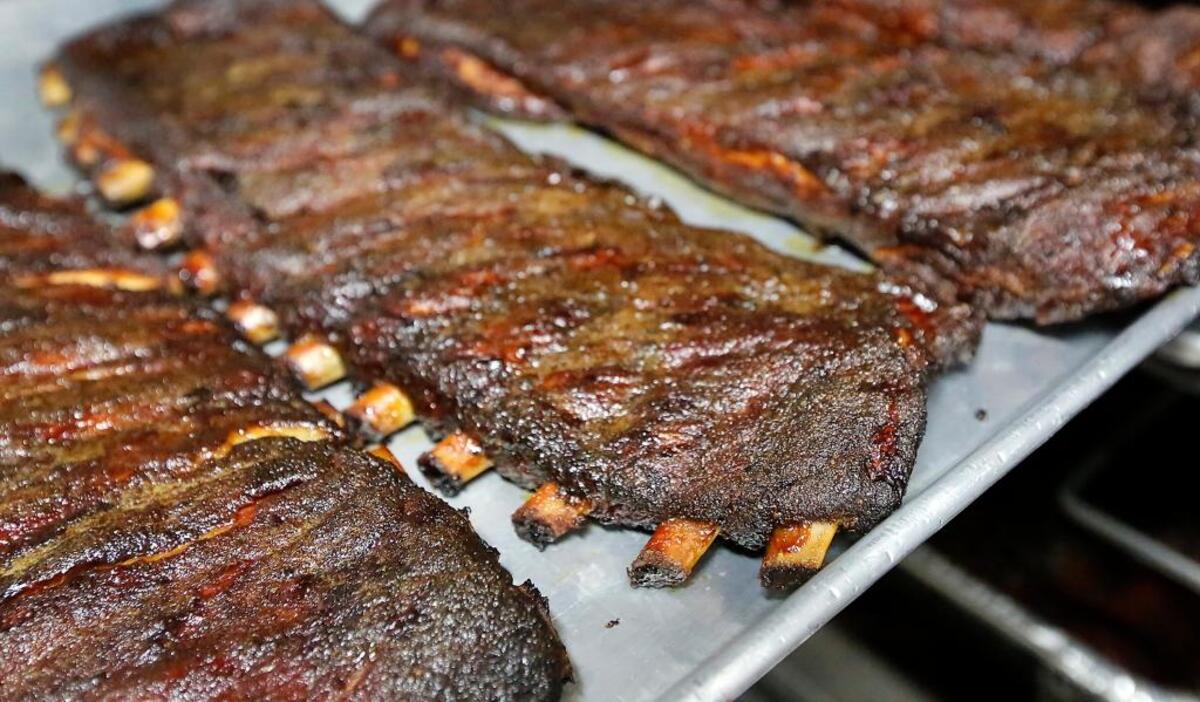 Racks of St. Louis-style smoked ribs are ready for the lunch crowd to converge at Porter’s Real Barbecue restaurant on the Richland Parkway. The popular local eatery is adding a new location in a few months on Columbia Center Boulevard in Kennewick.