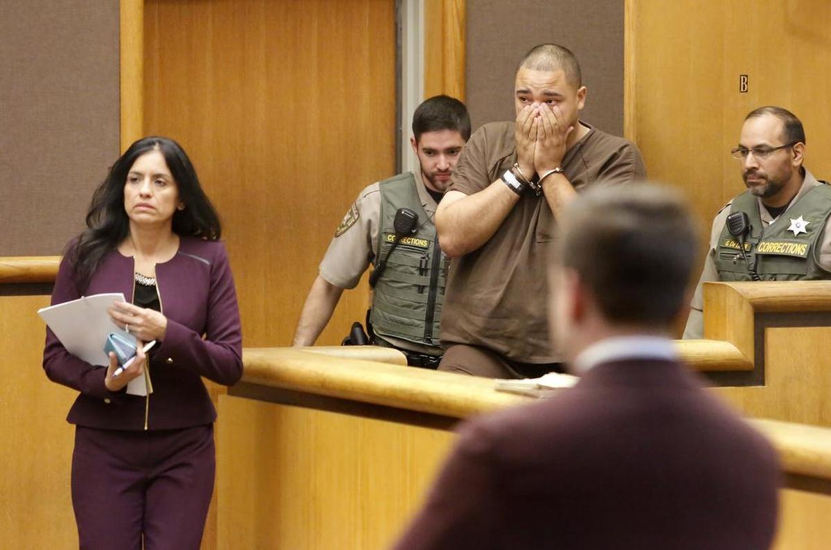 October 11, 2018 - Devan L. Thompson covers his face as he walks into Benton County Superior Court on Wednesday with his attorney Norma Rodriguez, left, at the Benton County Justice Center in Kennewick. The Everett man is under investigation for Sunday’s fatal shooting of a Kennewick man.