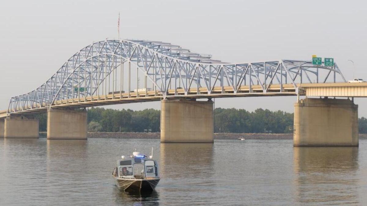 Deputies patrol near the blue bridge Monday evening as Columbia Basin Dive Rescue searched for Brandon Martin.