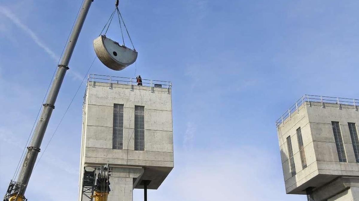 Half of a drum is lifted in early February back into place after maintenance in the south tower for navigation lock machinery at Ice Harbor Dam on the Snake River.