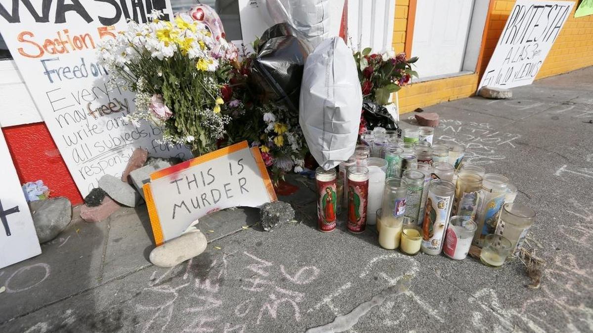 Protest signs, veladoras, rocks, flowers and messages of support written in chalk on the sidewalk could be seen outside of Vinny's Bakery on 10th Avenue and Lewis Street in Pasco Antonio Zambrano-Montes was shot by Pasco police.