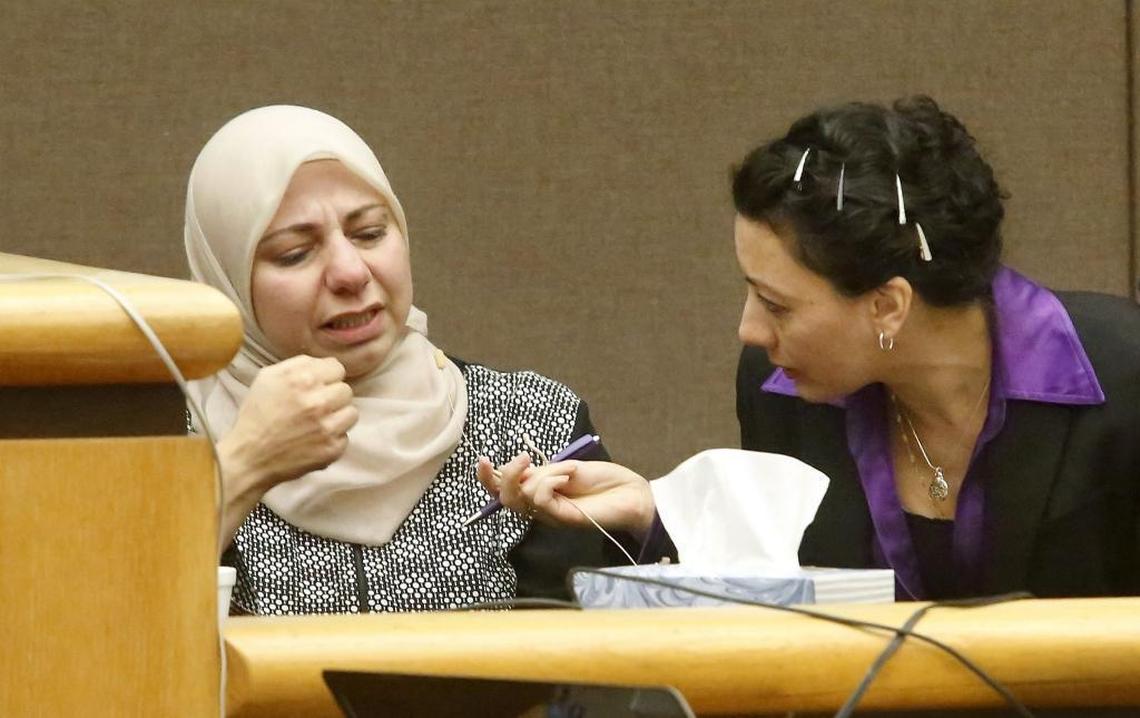 April 12, 2018 - Stabbing victim Dania Z. Alhafeth motions with her hand how her husband “hit” her with a knife during an attack on Aug. 30 in their Kennewick apartment during her testimony Wednesday in Benton County Superior Court. Arabic court interpreter Diana Noman sits near Alhafeth to translate her statements.