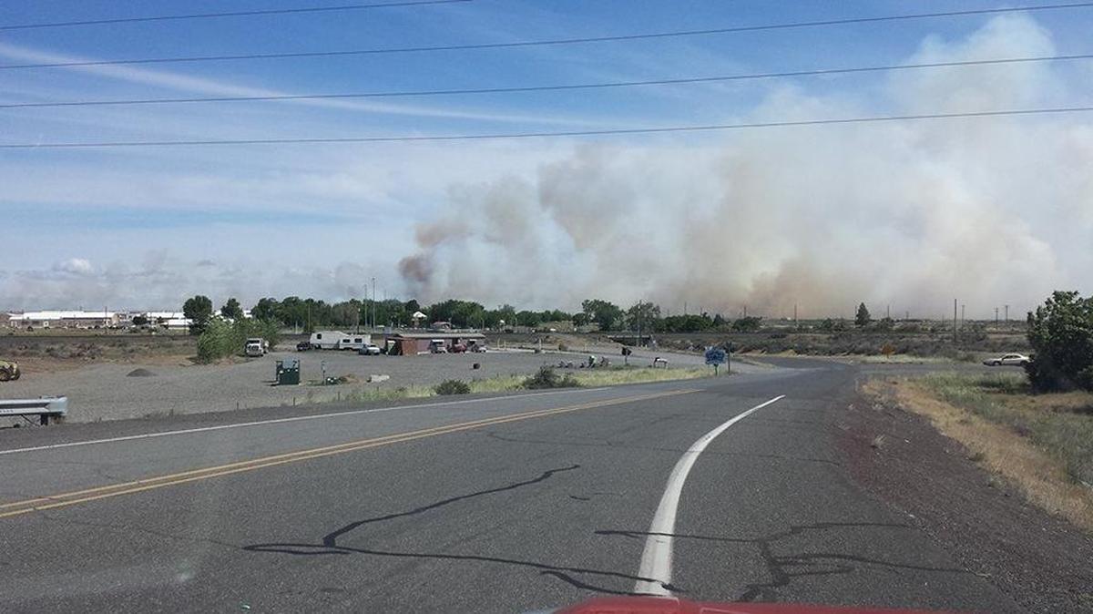 Winds were pushing a wildfire on the former Umatilla Chemical Depot toward Interstate 82 Monday morning.