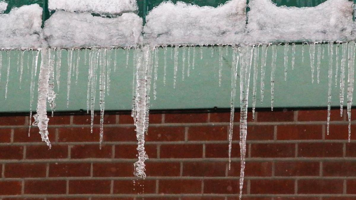 Icicles hang the side building of the Thai Elephant restaurant on Clearwater in Kennewick. Warmer weather had icicles melting on Saturday.
