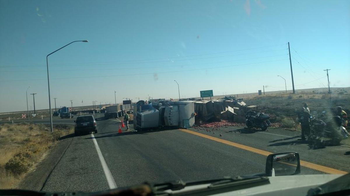 A semi hauling apples overturned near the Hanford Yakima Barricade at Highways 24 and 240 Saturday morning. Several motorcyclists reportedly had to slide to avoid the wreckage.