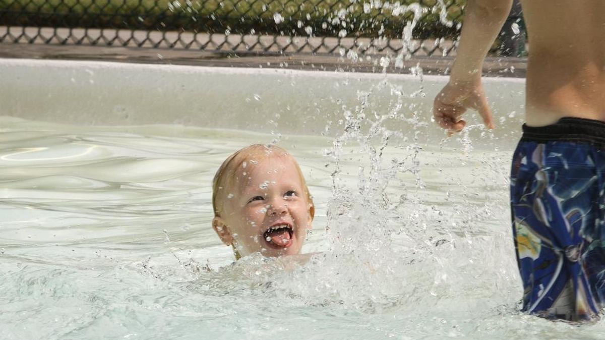 Xandr Neily, 3, plays in a splash pool at the aquatic playground in Civic Center Park during a warm afternoon in Kennewick on Thursday. Neily was accompanied by his mother, Samantha Neily of Kennewick. According to the National Weather Service Thursday afternoon was sunny and hot, with a high near 100 degrees with widespread haze and patchy smoke. A heat and air advisory alert is in place. Friday will be sunny and hot, with a high near 104 degrees.