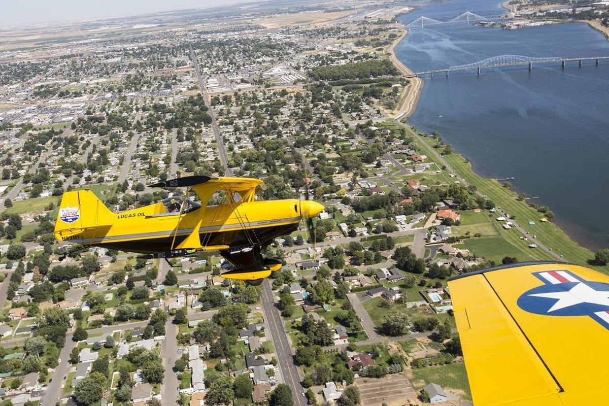 July 28, 2017 - Buck Roetman flies his Pitt S2S just behind Barry Hancock’s plane, a North American Aviation T-6 Texan, on Thursday over Pasco. Both pilots will be a part of the Tri-City Water Follies for the HAPO “Over the River” Airshow.