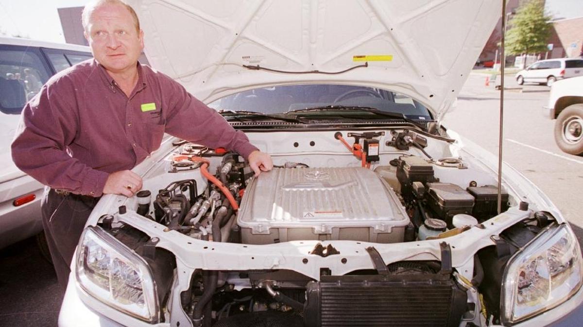 The owner of an electric SUV shows “the brains” of the vehicle. Tri-City-area owners of electric cars will display their vehciles in Richland Sept. 9 and answer questions about them.