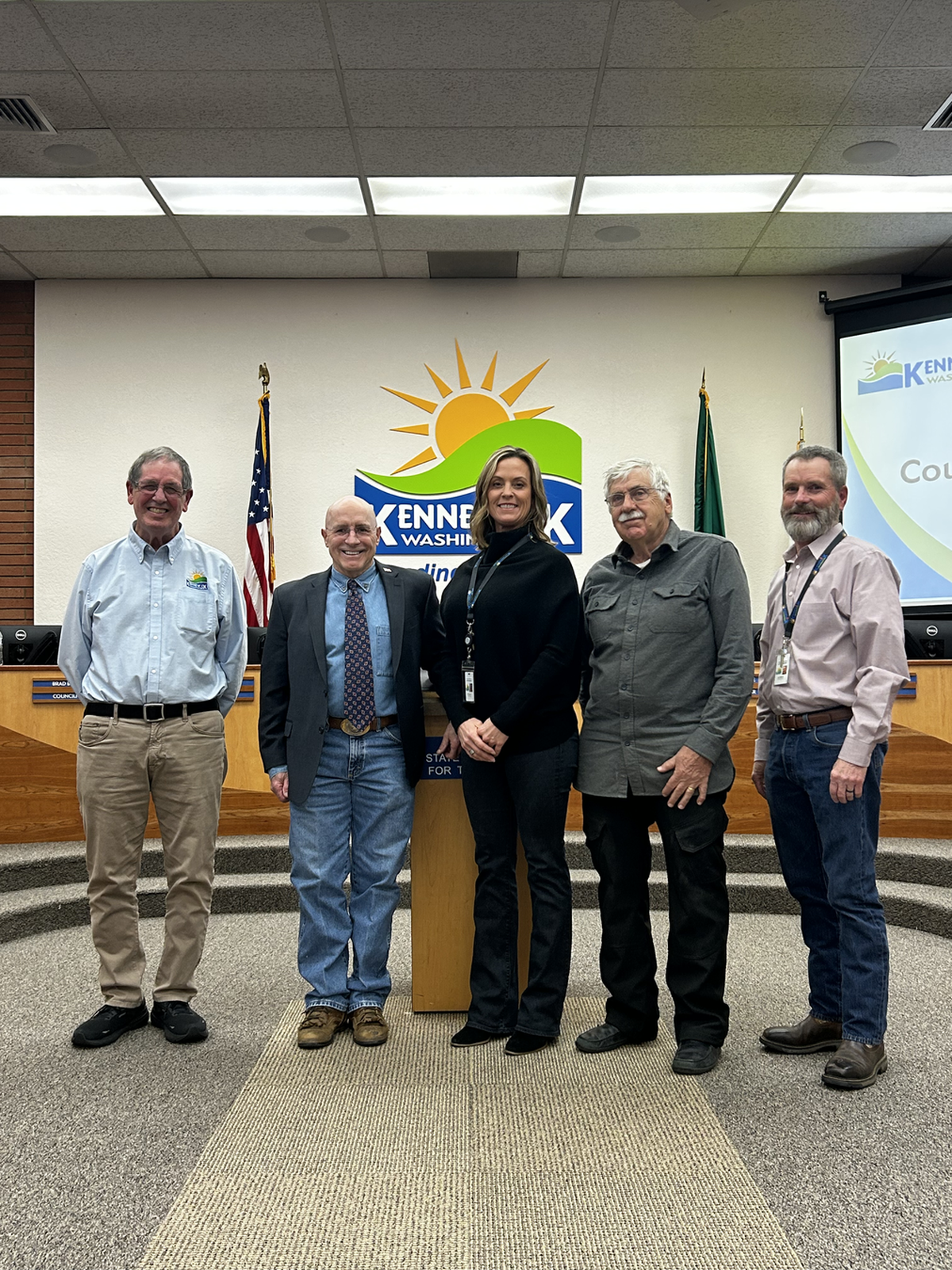 New at-large Kennewick Councilman Brad Klippert, second from left, poses for a photo with his fellow electeds at a meeting Tuesday night. They are, from left, Councilman Chuck Torelli, Mayor Gretl Crawford, Councilman John Trumbo and Councilman Jim Millbauer.
