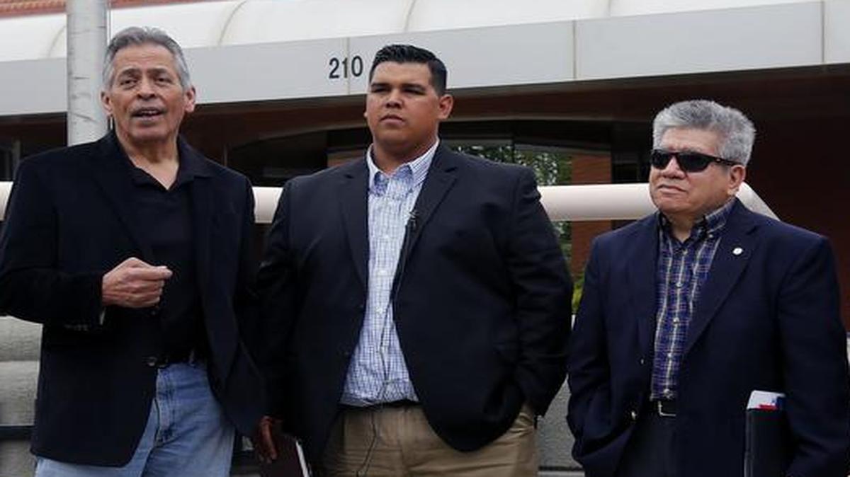 Kennewick Latino community group leaders Rick Rios, Leo Perales and Gabriel Portugal — accompanied by a man on the right who would give his name only as Edison — speak during a press conference Wednesday at Kennewick City Hall. After talking to the city manager, the coalition decided not to call for a boycott of Kennewick and has started plans for a diversity commission in the community.