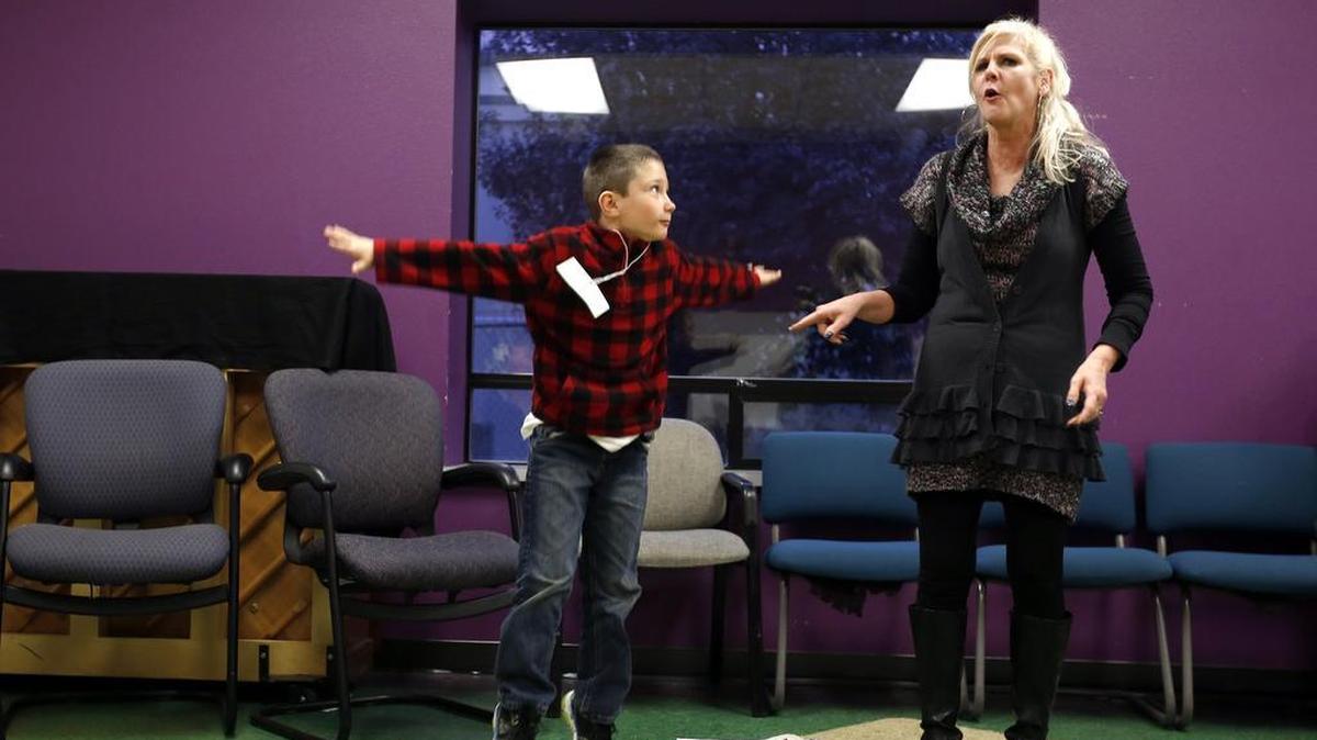 Julie Schroeder, ACT’s education director, looks on as Caleb Wampole acts out a character Thursday during a class at the Academy of Children’s Theater in Richland. The new program was created for children on the autism spectrum.