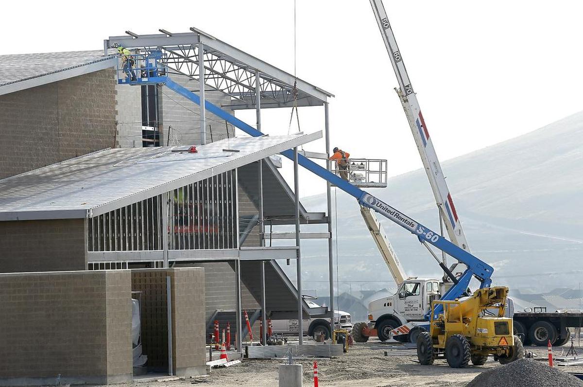 File -- Construction workers install steel beams in 2018 at the Richland School District’s newest elementary school in West Richland.