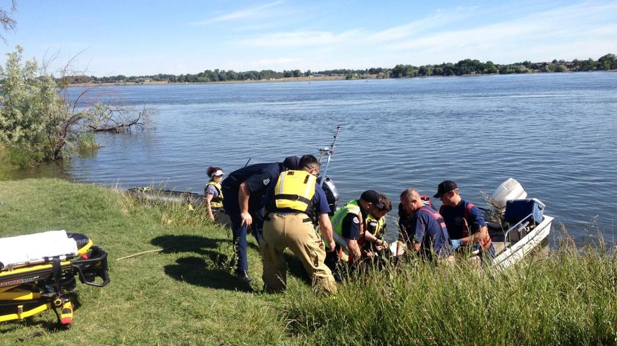 Emergency crews work to help a boater having a problem Wednesday morning on the Columbia River at Kennewick’s Columbia Park. More details about what happened were not immediately available.