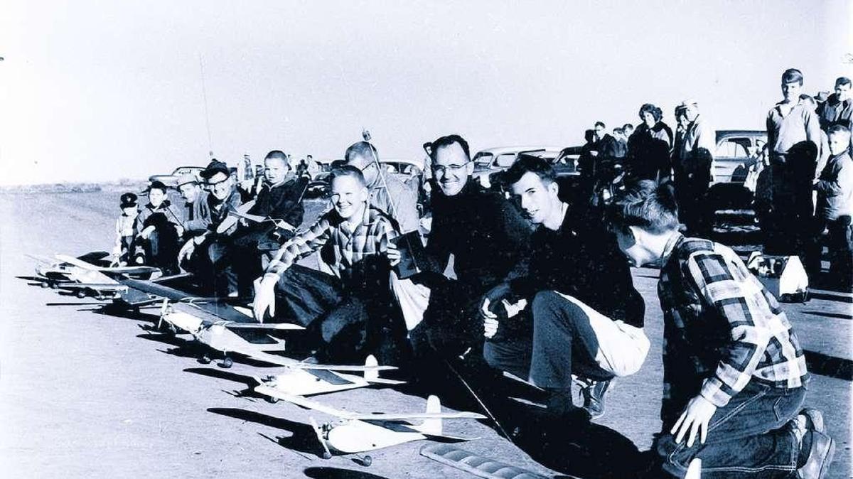 Contestants prepare model airplanes for takeoff during a contest which took place at the old bombing range north of Pasco in this Nov. 13, 1961, photo. Contestants were, from front to back, Van Casey, Chuck Bailey, Zane Casey, Fred Fisher, John Fisher, Fred Bonar, Charles Bailey and Pete and David Dallaire. The event was sponsored by the Tri-City Radio Control Modelers.