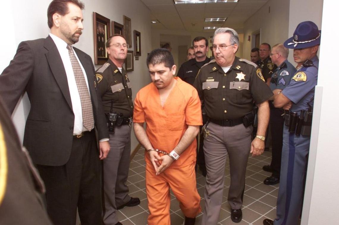 Nicolas Solorio Vasquez was escorted past law enforcement officers into a Franklin County courtroom in August 2001 for his guilty plea to aggravated first-degree murder. He got life in prison for fatally shooting Washington State Patrol Trooper James Saunders on Oct. 7, 1999.
