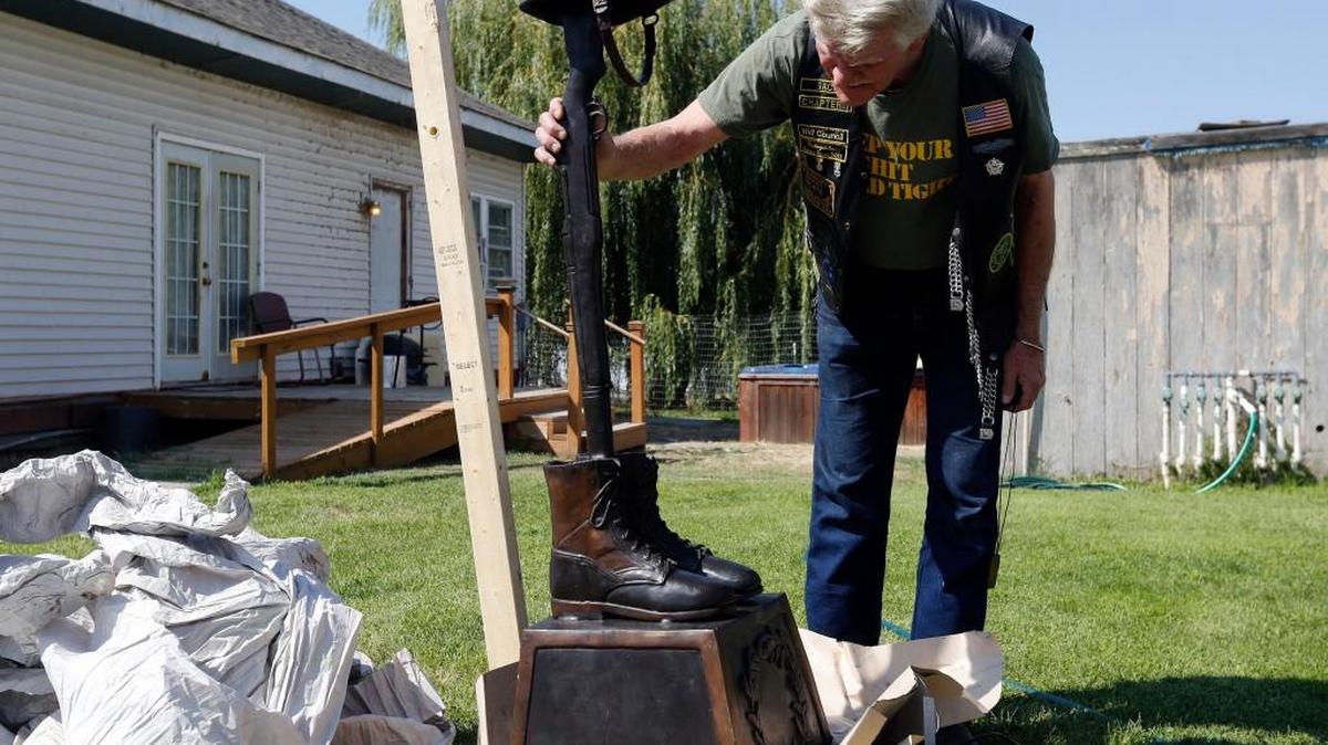 Bobby Dale, a Vietnam veteran and member of Combat Veterans International, looks at the details on a new statue for the Final Tribute veterans memorial to be installed at Flat Top Park in West Richland. The statue will replace a vandalized statue that was dedicated in 2001.