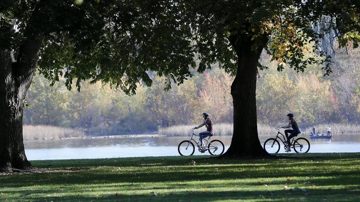 Bicyclists and anglers enjoy the sunny weather Monday along the Columbia River near Howard Amon Park in Richland. More sunny skies with high temperatures are forecast for the next several days.
