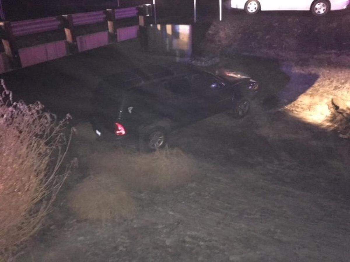 West Richland police responded to help the Benton County Sheriff’s Office after slick roads landed an SUV in a dry canal.