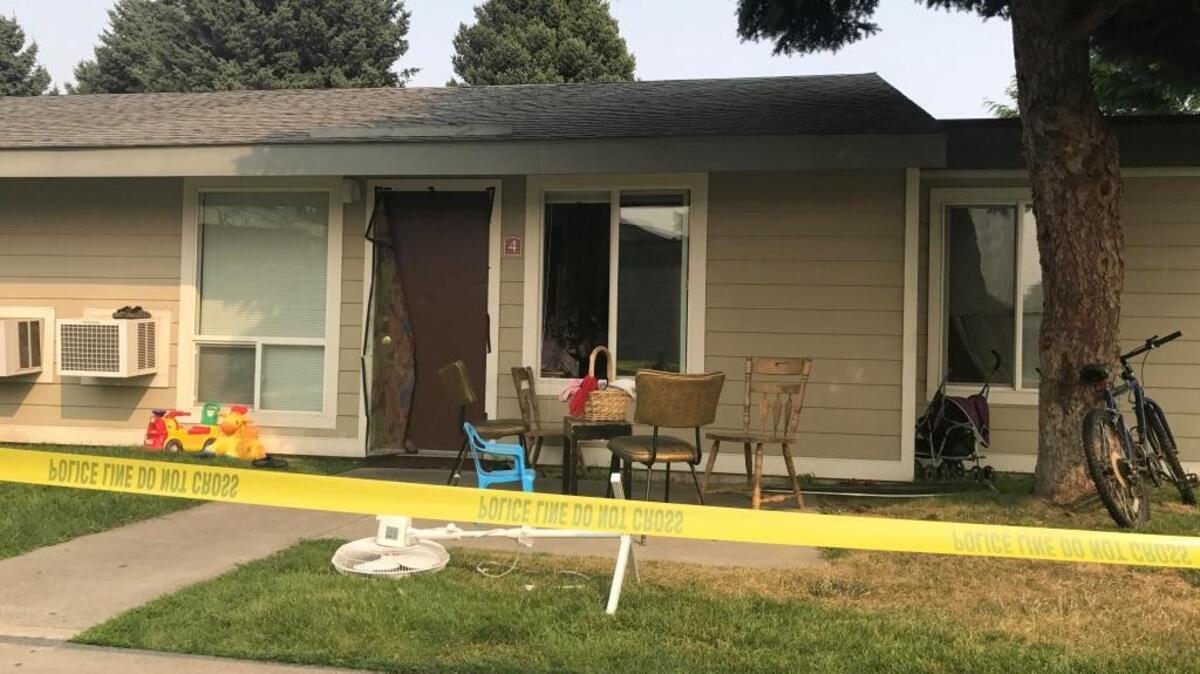 Crime scene tape surrounds an apartment in K Building at Central Park Apartments in Kennewick. Police say two people were hurt in a knife attack there.