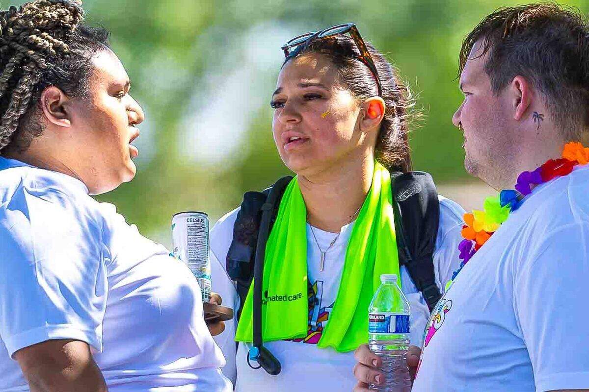 A’isha Martin, president of Tri-Cities Pride, center, visits with board members Lucy Mercado, left, and Brenton Nundahl during the Tri-Cities Pride Festival on June 14 at Memorial Park in Pasco. Martin said the event has grown to more than 130 vendors and exhibitors this year.