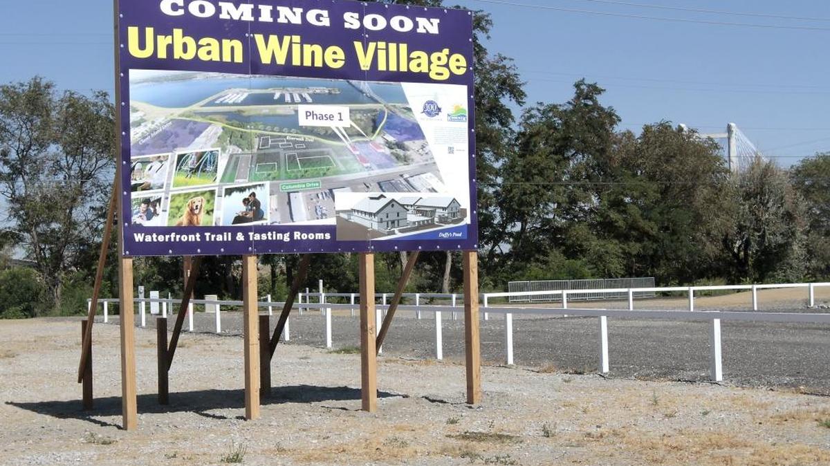 A bilboard marks the site of the first phase of a joint project by the Port of Kennewick and the city of Kennewick to create a boutique wine development on Columbia Drive. The estimated $3 million project is for three winery buildings, a shell building a city-funded winery wastewater pretreatment plant and other site work.