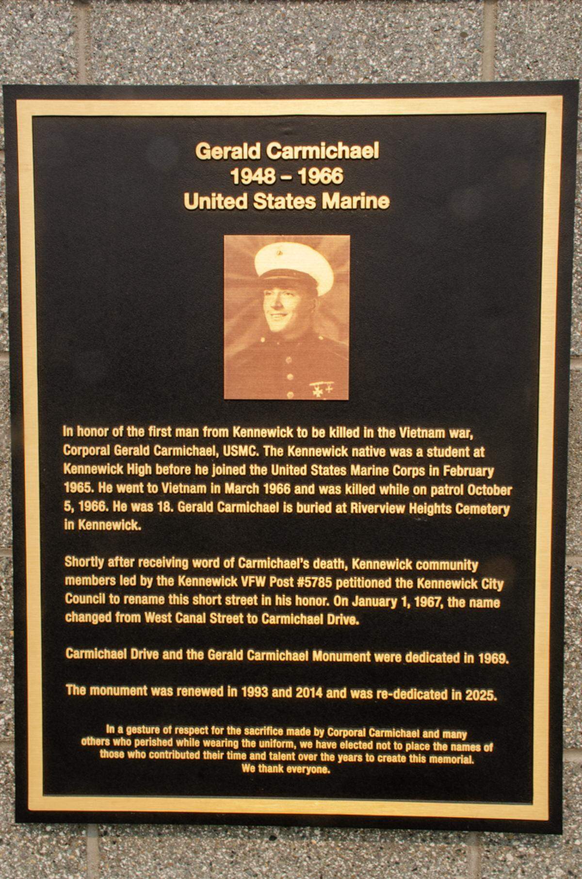 A plaque on the Cpl. Gerald Carmichael memorial tells the site’s history. It will be rededicated this year after improvements were made possible by donors and volunteers.