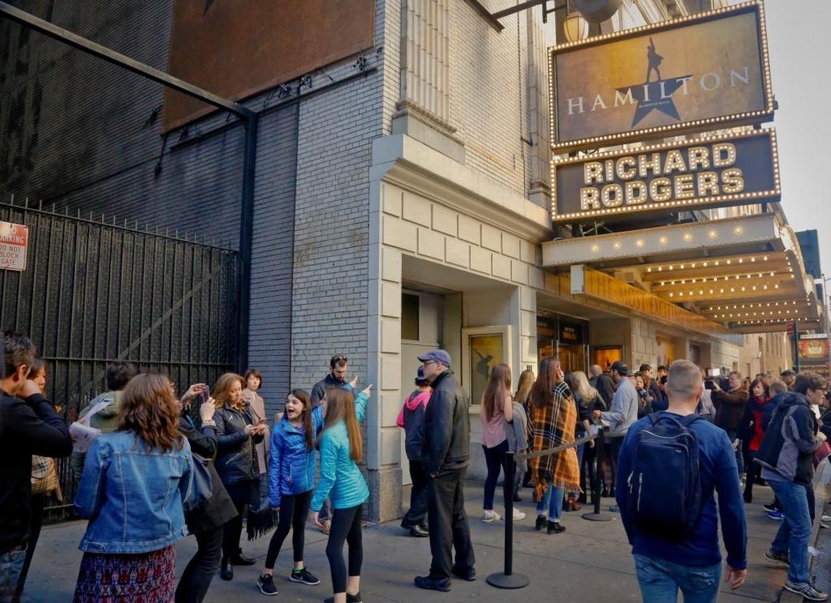 People line-up to see the Broadway play “Hamilton” in November 2016 in New York.