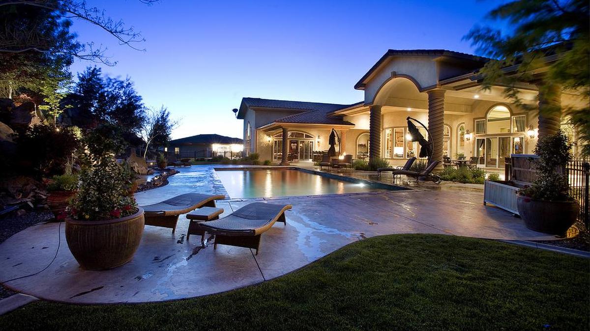 Former National Hockey League goalie Olaf Kolzig and his wife are selling their 15,260-square-foot home in Badger Canyon. The backyard area includes an outdoor kitchen, complete with grill, sink, fridge and TV, as well as a swimming pool, hot tub and area for entertaining.