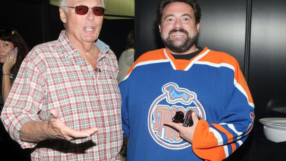 Adam West, left, and Kevin Smith are seen at Stan Lee’s Comikaze Expo in 2012 in Los Angeles.