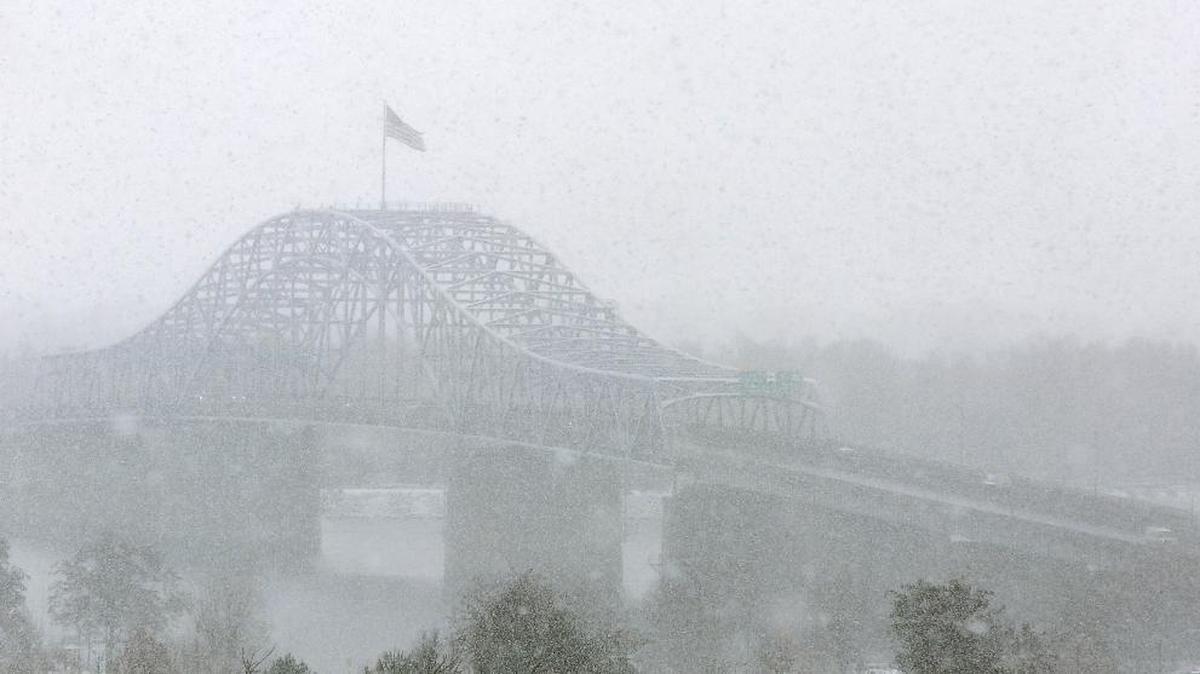 A heavy dose of snowflakes fill the air Tuesday morning obscuring the blue bridge from a vantage point near the Highway 395 overpass for Canal Drive in Kennewick. Most area schools were on a two-hour delay as snow continued to fall throughout the morning. A new winter storm system is forecast to arrive Thursday night, making snow likely Friday, according to early forecasts by the weather service.